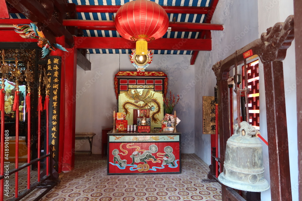 Hoi An, Vietnam, March 8, 2021: One of the altars with dragons in a Taoist Temple in Hoi An, Vietnam