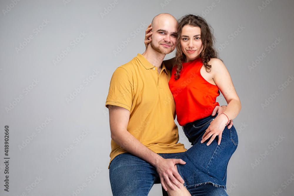 White young man and woman isolated on gray White young man and woman isolated on gray