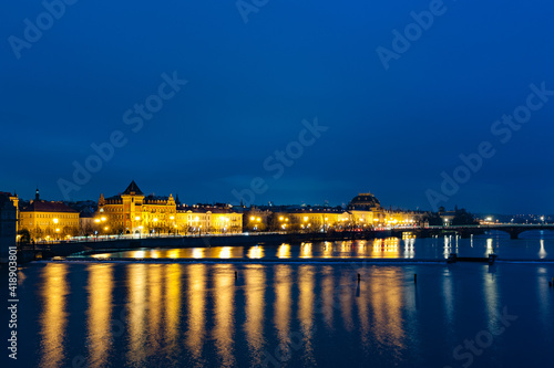 View from the Charles bridge in Prague over the Vlatva river at night