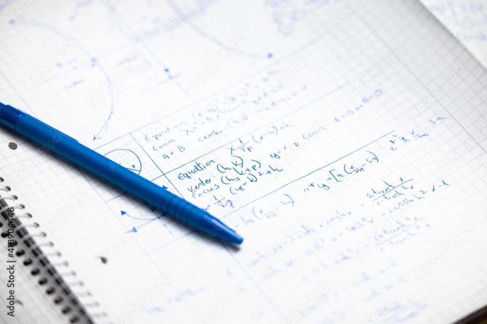 Math exersize in white notebook closeup Math exersize in white notebook closeup