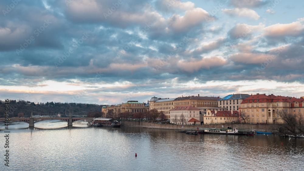 View from the Charles bridge in Prague over the Vlatva river on cloudy day