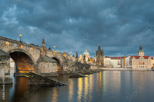 View from the Charles bridge in Prague over the Vlatva river on cloudy day