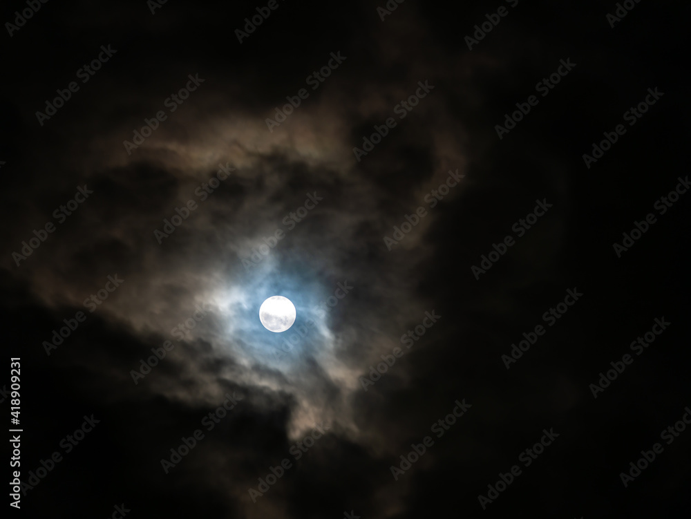 Clouds were All Over The Sky behind The Halo Moon