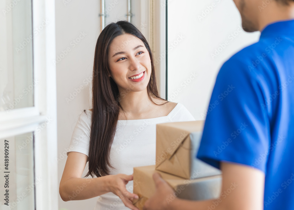client receiving package box from the delivery man at home client receiving package box from the delivery man at home