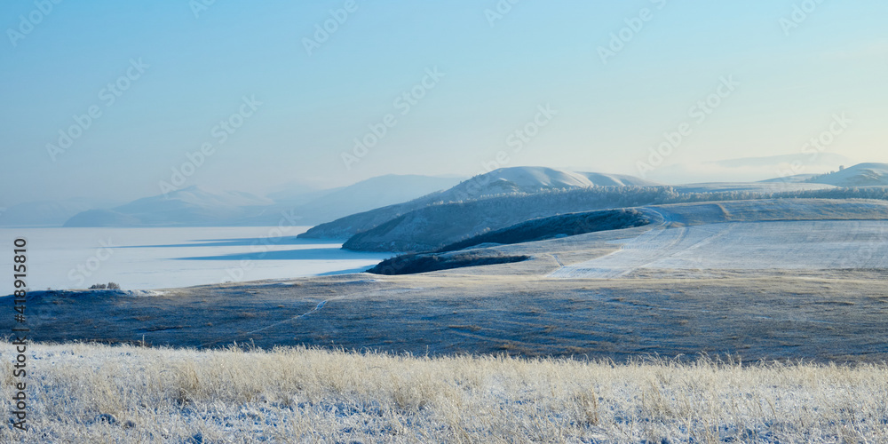 Obraz premium Winter sunny day near the banks of the Yenisei.
