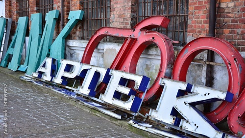 Detail of old neon inscription with the letters photo