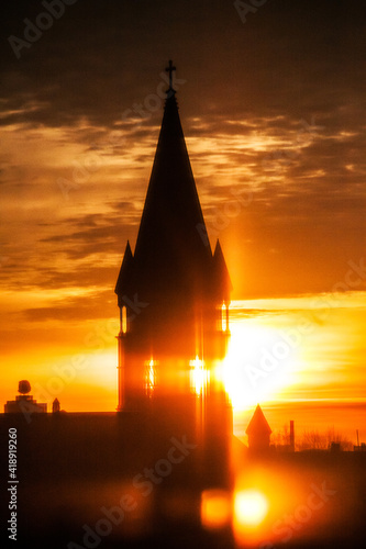 Print op canvas sunrise behind a church steeple