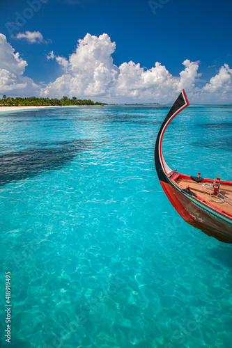 Fototapeta Naklejka Na Ścianę i Meble -  Inspirational Maldives beach design. Maldives traditional boat Dhoni and perfect blue sea with lagoon. Luxury tropical paradise concept