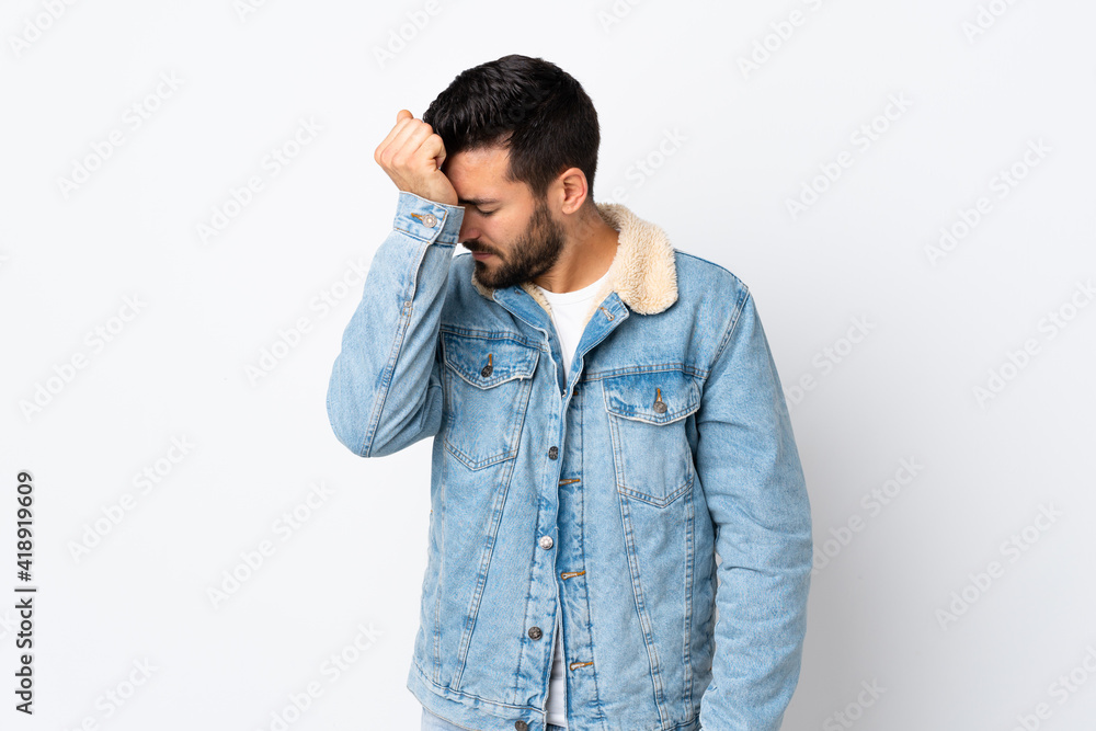 Young handsome man with beard isolated on white background with headache Young handsome man with beard isolated on white background with headache