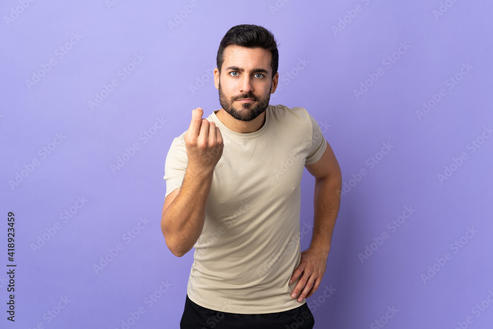 Young handsome man with beard over isolated background making Italian gesture Young handsome man with beard over isolated background making Italian gesture