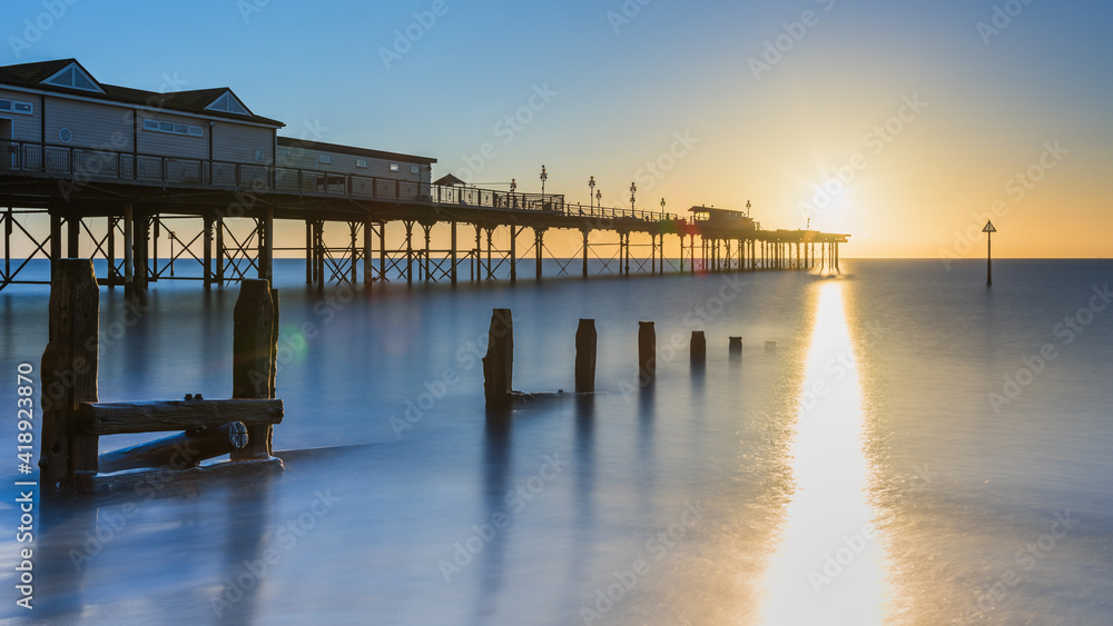 Sunrise in long time exposure of Grand Pier in Teignmouth, Devon, England, Europe