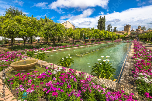 Cordoba, Andalusia, Spain - April 20, 2016: The colorful and blooming gardens in the spring of Alcazar de los Reyes Cristianos in Cordoba, Andalusia, Spain. © bennymarty