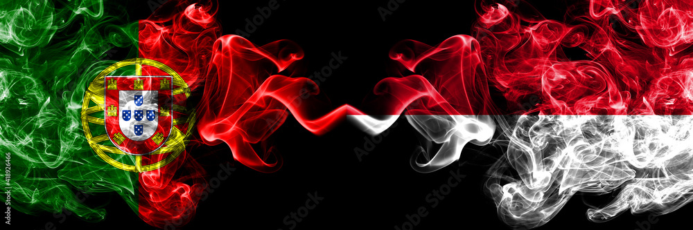 Portugal, Portuguese vs Monaco, Monacan smoky mystic flags placed side by side. Thick colored silky abstract smoke flags. Portugal, Portuguese vs Monaco, Monacan smoky mystic flags placed side by side. Thick colored silky abstract smoke flags.