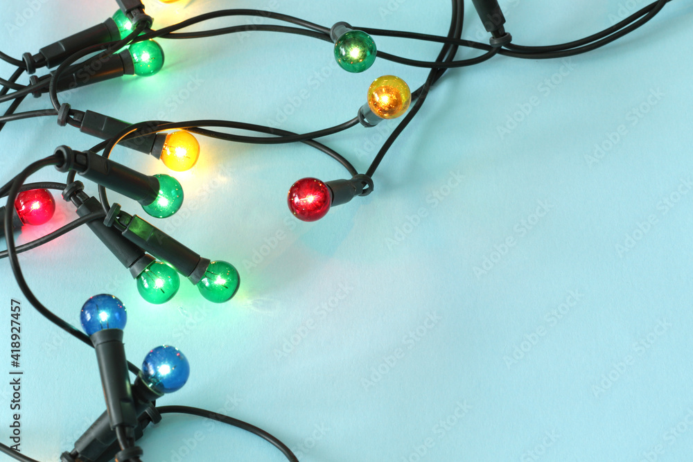 colourful christmas lights on blue background colourful christmas lights on blue background
