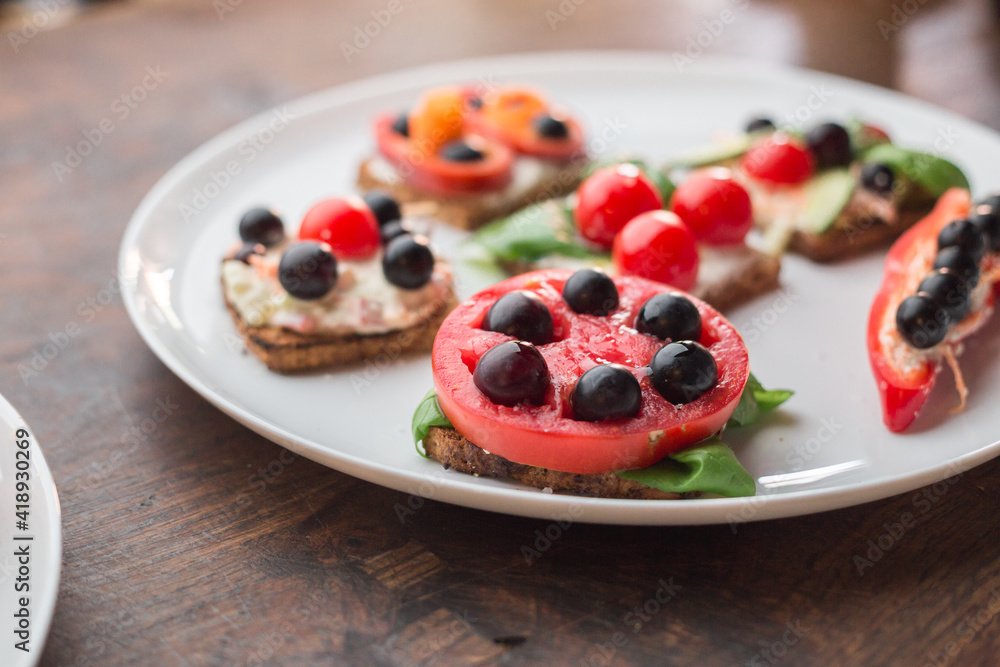 Tasty looking vegetarian sandwiches on a white plate Tasty looking vegetarian sandwiches on a white plate