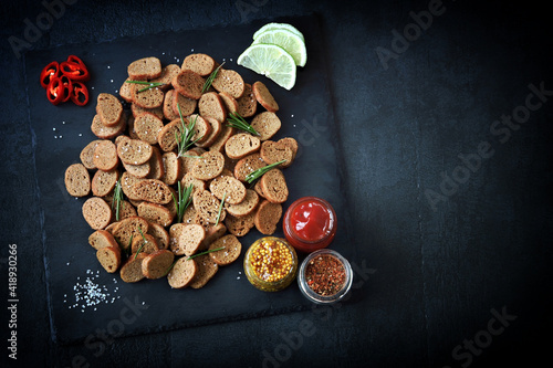 Rye croutons with rosemary and spices. Healthy snack. Homemade croutons. Beer snack.