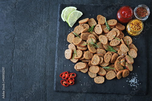 Rye croutons with rosemary and spices. Healthy snack. Homemade croutons. Beer snack.