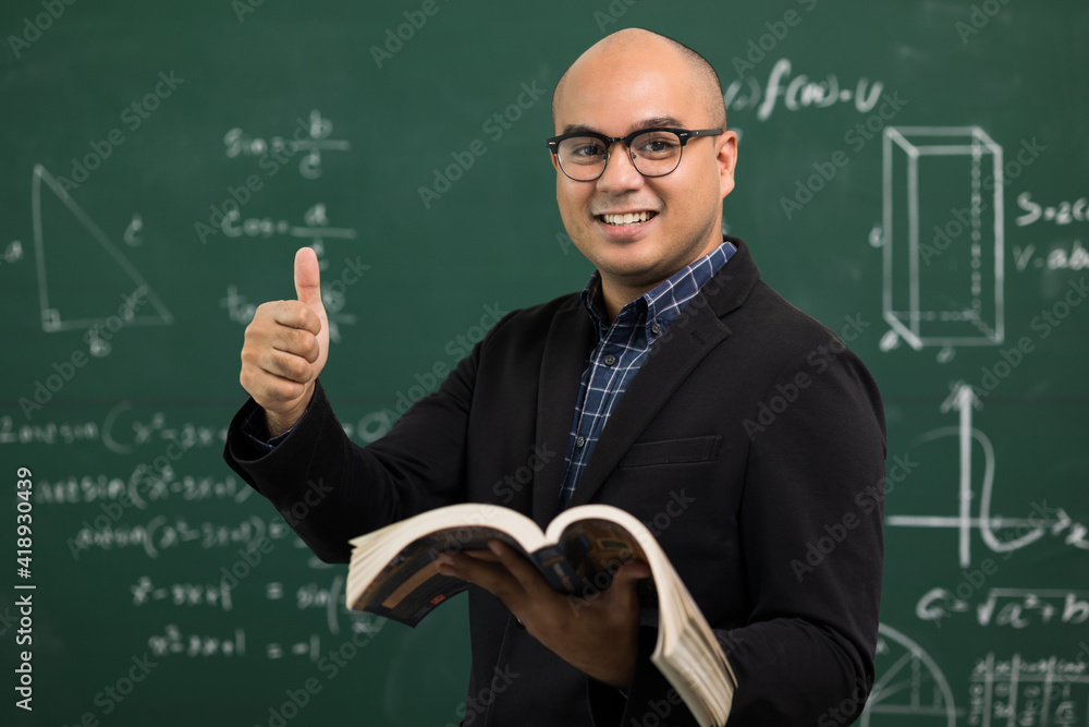 Young asian teacher man teaching video conference with student. Male Indian teacher training the mathematics in classroom from online course. Young asian teacher man teaching video conference with student. Male Indian teacher training the mathematics in classroom from online course.
