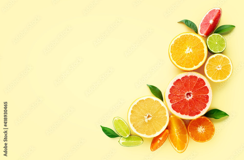 Creative composition of citrus fruits on yellow background Creative composition of citrus fruits on yellow background