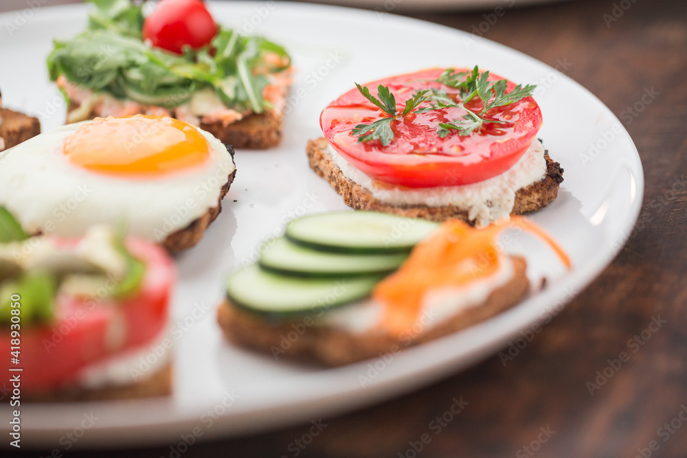 Freesh vegetarian sandwiches on a white plate