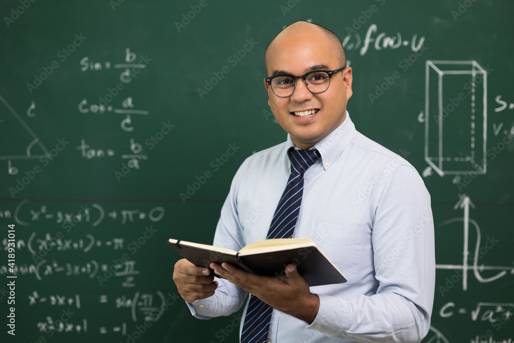 Young asian teacher man teaching video conference with student. Male Indian teacher training the mathematics in classroom from online course.