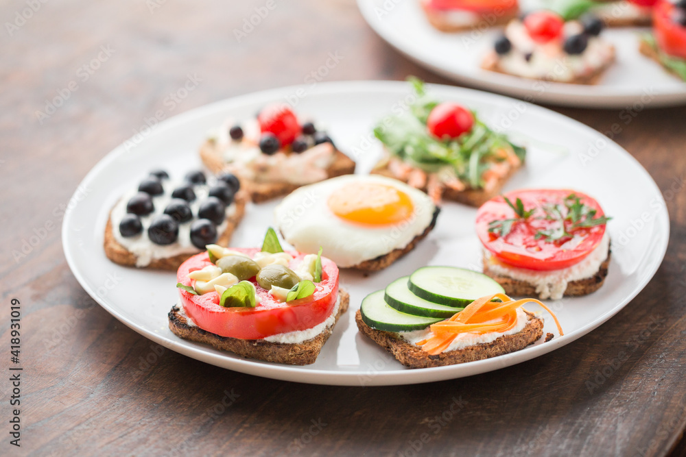 Freesh vegetarian sandwiches on a white plate Freesh vegetarian sandwiches on a white plate