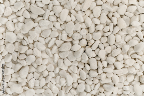 background with beach stones. beautiful stones of different shapes and sizes. stone texture. modern background with stone