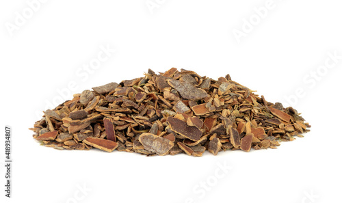 Cascara herb bark used in herbal medicine to treat constipation on white background. Rhamnus purshiana. photo