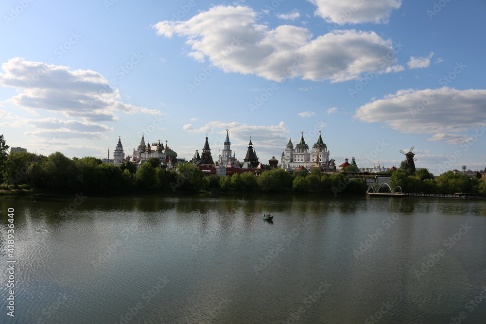 view of the Izmailovsky kremlin across the lake moscow Russia summer