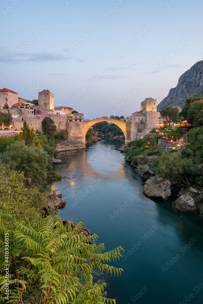 Stari Most bridge at twilight in old town of Mostar, BIH