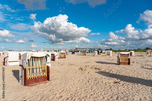 Sandy beach with beach baskets in Harlesiel