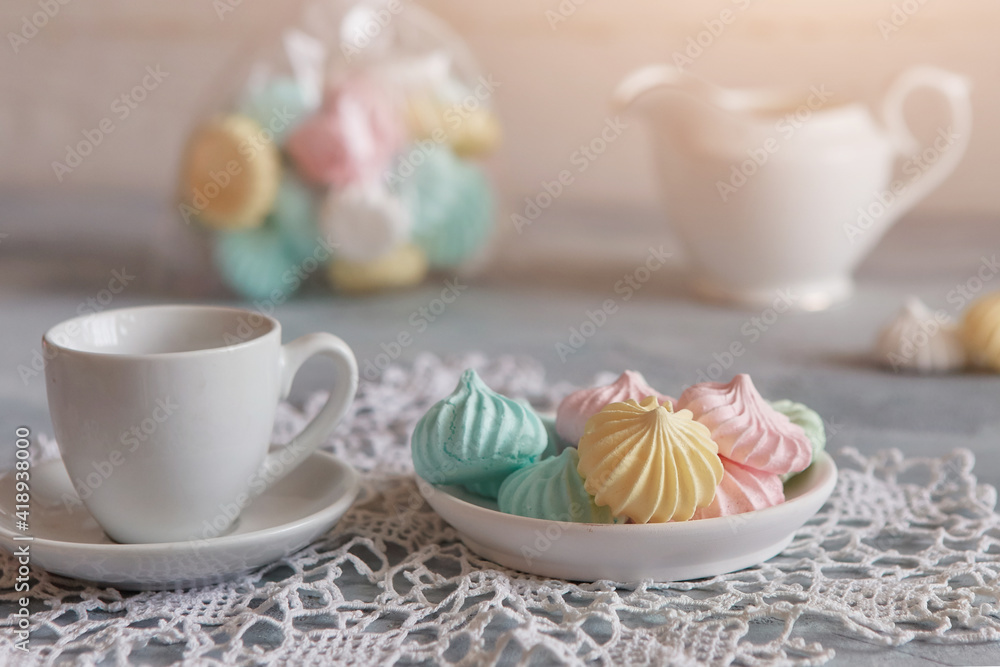 Meringue with a mug of milk, selective focus, close-up Meringue with a mug of milk, selective focus, close-up