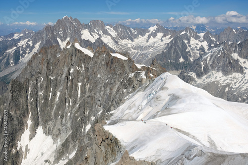 Trekkers hiking, Aiguille du Midi 3842m, Chamonix. photo