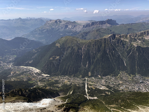 Summer glacier landscape with a view over the Chamonix valley and the surrounding peaks from Aiguille du Midi 3842m, Chamonix, France photo