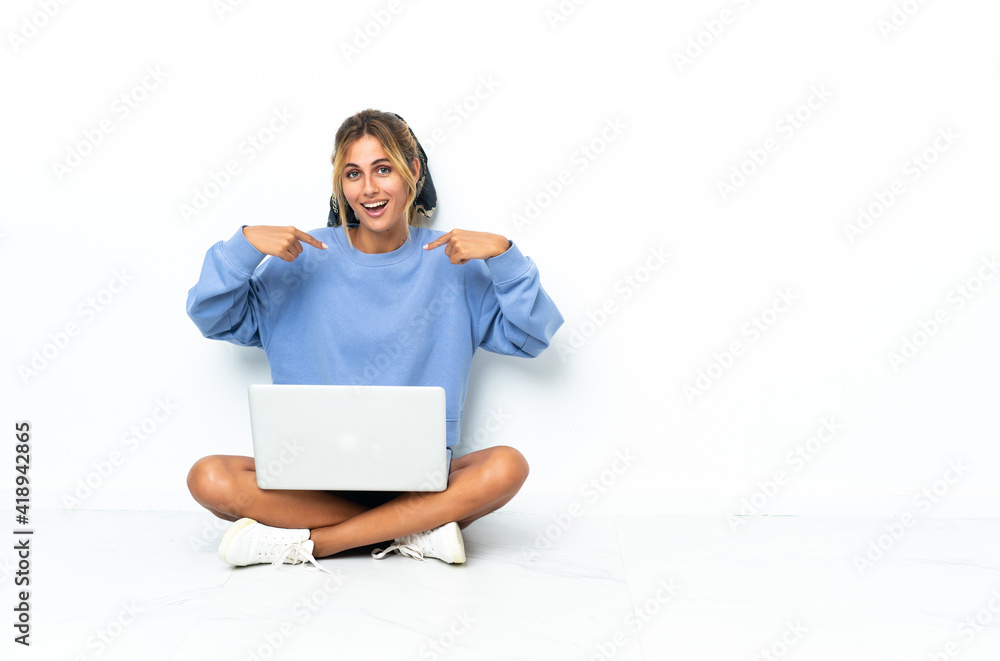 Young blonde Uruguayan girl with the laptop isolated on white background with surprise facial expression Young blonde Uruguayan girl with the laptop isolated on white background with surprise facial expression