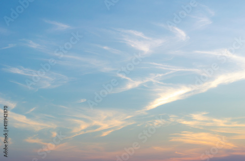 Beautiful Vivid sky painted by the sun leaving bright golden shades.Dense clouds in twilight sky in winter evening.Image of cloud sky on evening time.Evening Vivid sky with clouds.