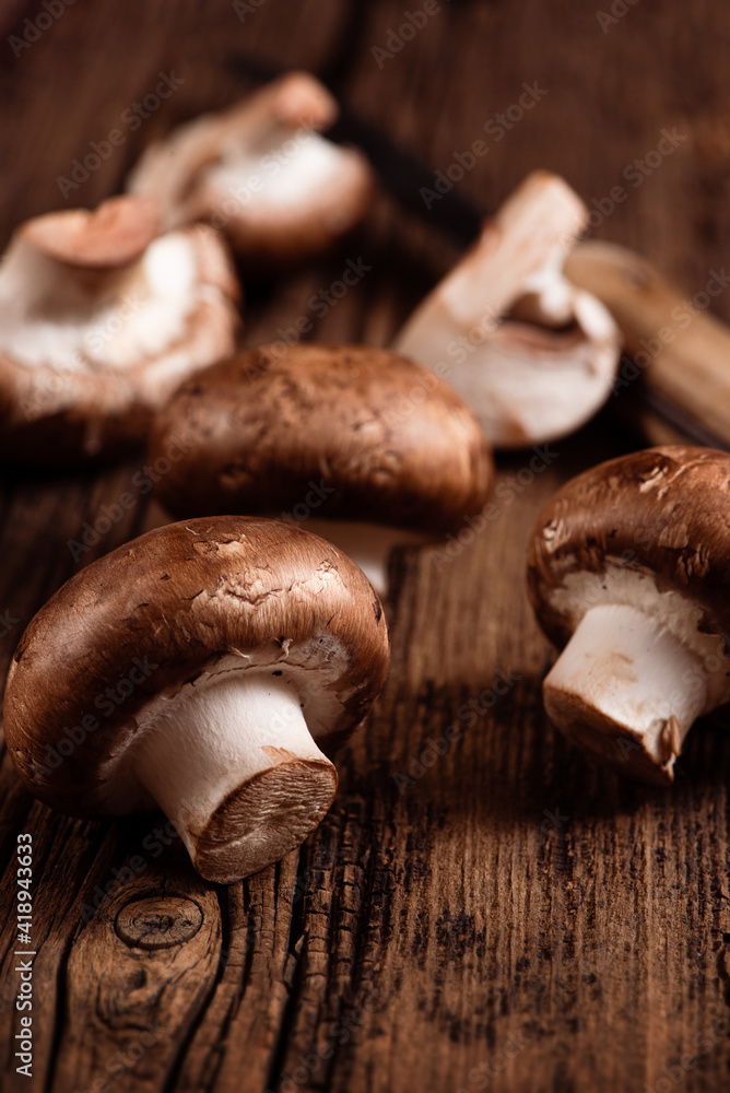 Royal champignon on wooden table. Crimini mushrooms. Closeup.