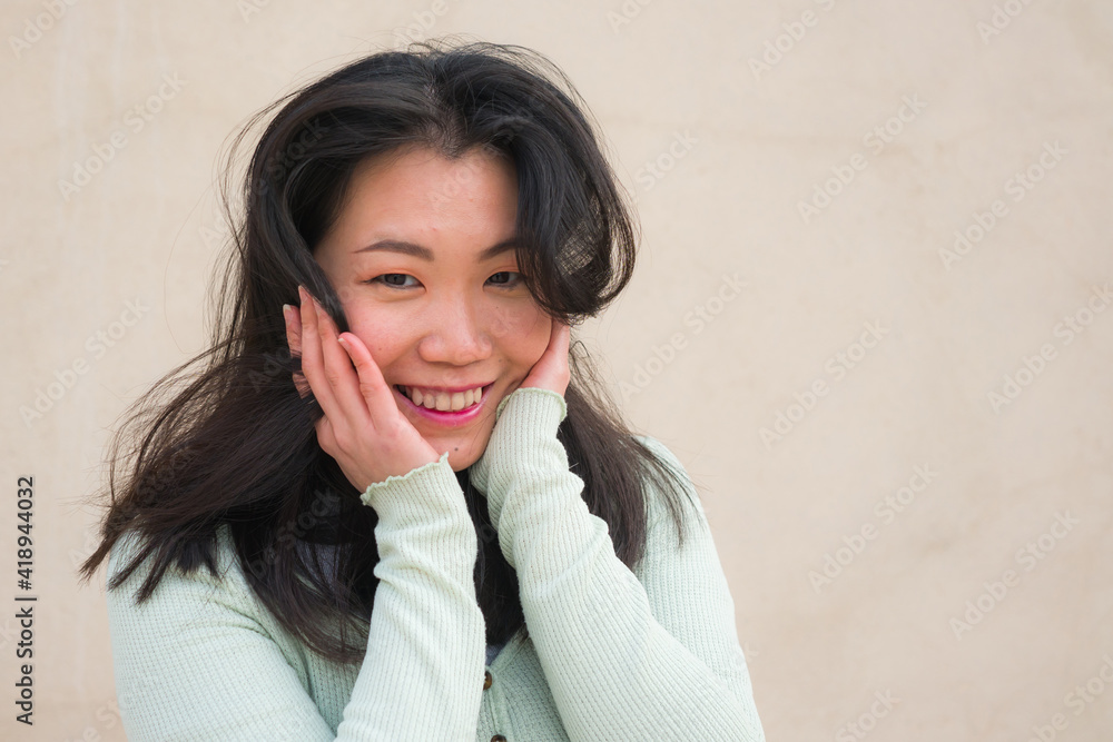 natural portrait of young happy and beautiful Asian Korean woman smiling cheerful posing playful bringing positive vibes outdoors on isolated background natural portrait of young happy and beautiful Asian Korean woman smiling cheerful posing playful bringing positive vibes outdoors on isolated background