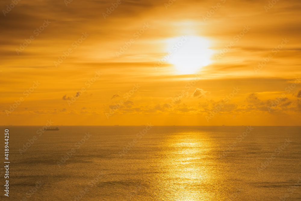 Bright beautiful sunrise or sunset at sea