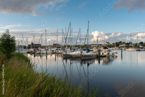 Landscape with sailing yachts on the river Harle in Harlesiel