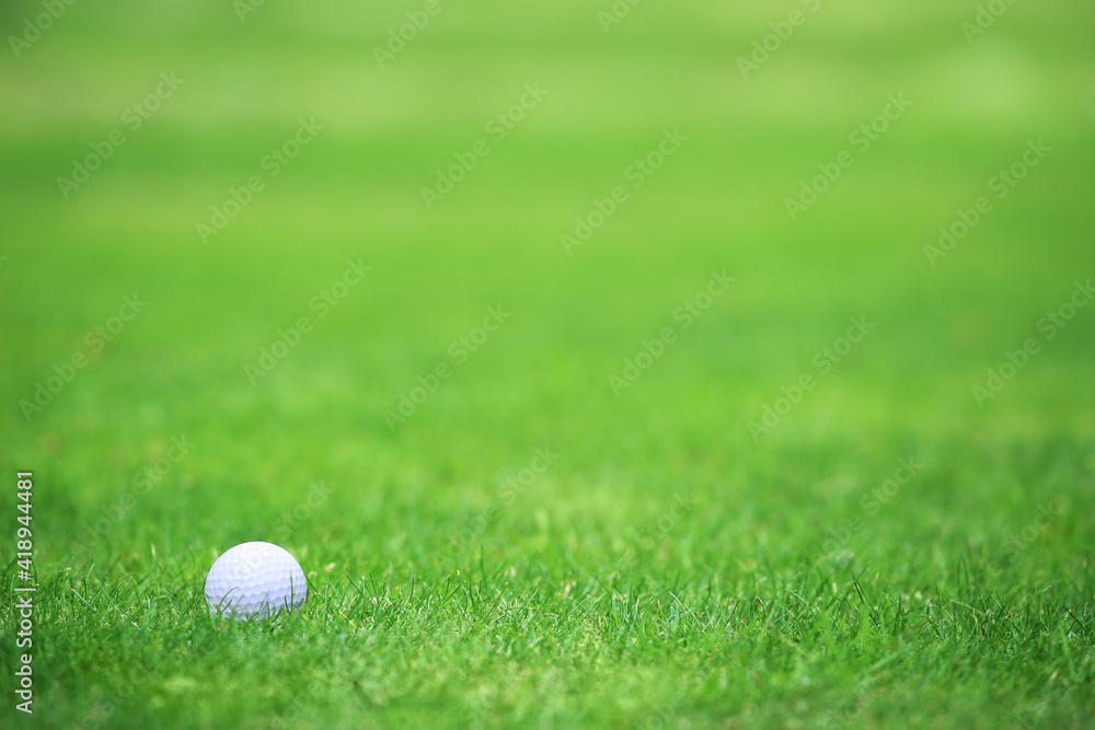 Golf ball on green grass background Golf ball on green grass background