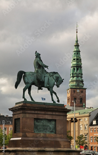 Equestrian Statue of King Frederik VII and Saint Nicholas church in Copenhagen. Denmark