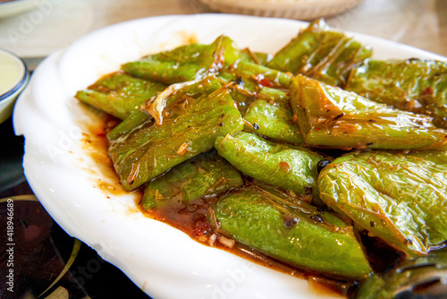 A delicious Chinese dish, fried tiger skin green peppers