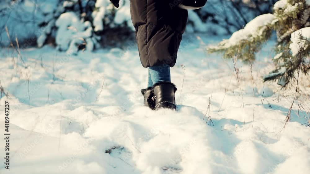 Legs Footprints In Winter Boots Walking On Snow. Adventure Vacation Hiker Hiking In Winter