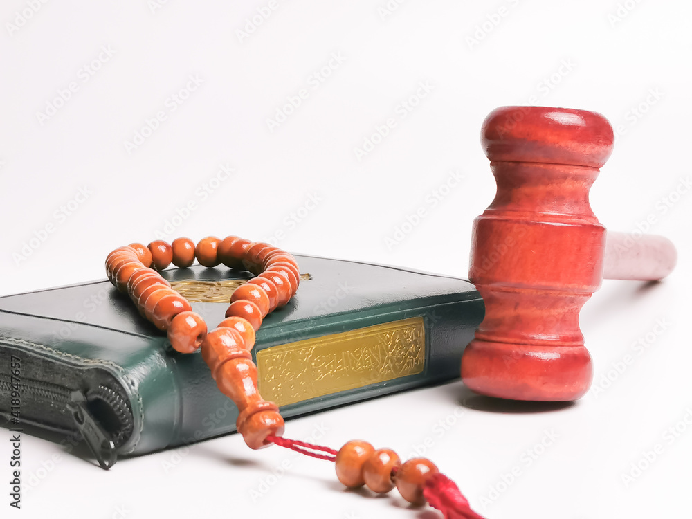 Selective Focus Close Up Image Tasbih Or Rosary Beads With Holy Quran Written Arabic Calligraphy