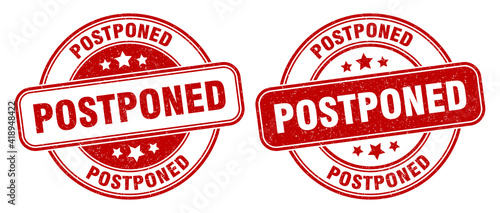 postponed stamp. postponed label. round grunge sign