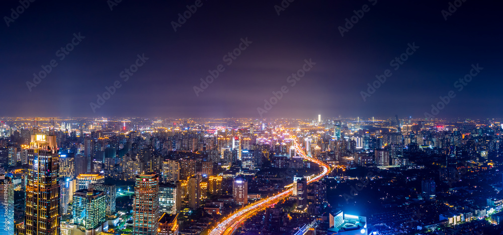 Obraz premium Shanghai skyline and buildings with highway at night.