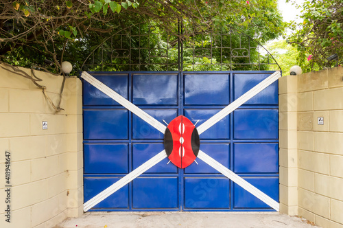 Iron gate with a white cross photo