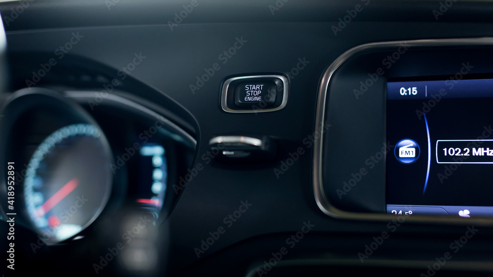 Start stop engine modern new car button.