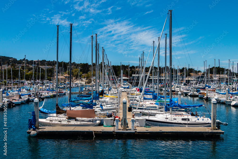 Many sailboats sit idle waiting to be sailed from the Monterey Bay Marina